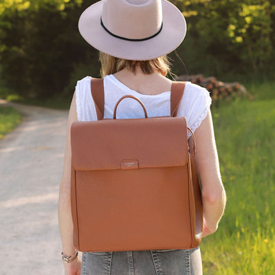 Storksak St James Leather Tan Nappy Bag Backpack on Mum